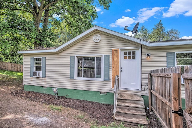 713 Maple Rd, Ionia, MI 48846 - view of front facade featuring crawl space and cooling unit