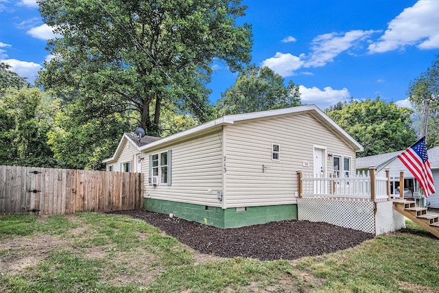 713 Maple Rd, Ionia, MI 48846 - view of property exterior featuring a wooden deck and crawl space