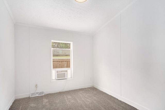 713 Maple Rd, Ionia, MI 48846 - empty room featuring carpet floors, ornamental molding, a textured ceiling, and cooling unit