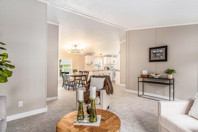 713 Maple Rd, Ionia, MI 48846 - living area featuring light carpet, a textured ceiling, crown molding, and a chandelier