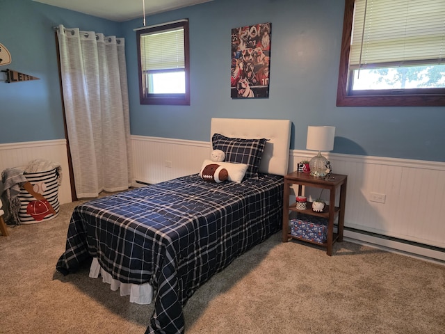 1236 Klink Rd, Tekonsha, MI 49092 - bedroom featuring a wainscoted wall, carpet floors, and a baseboard heating unit