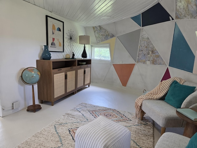 1236 Klink Rd, Tekonsha, MI 49092 - living area featuring finished concrete flooring, vaulted ceiling, and wood ceiling
