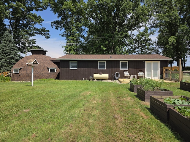 1236 Klink Rd, Tekonsha, MI 49092 - back of property featuring a vegetable garden