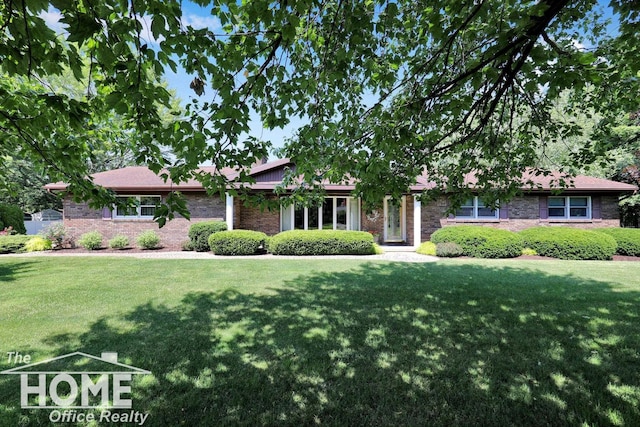 2367 Meadowdown Dr, Owosso, MI 48867 - view of front of house with a front yard and brick siding