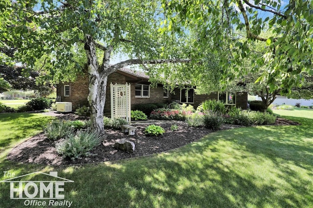 2367 Meadowdown Dr, Owosso, MI 48867 - view of front facade featuring brick siding and a front yard
