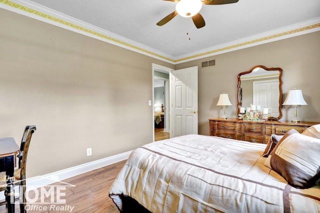 2367 Meadowdown Dr, Owosso, MI 48867 - bedroom featuring wood finished floors, ornamental molding, and a ceiling fan