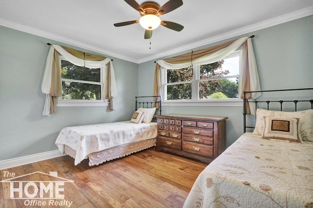 2367 Meadowdown Dr, Owosso, MI 48867 - bedroom featuring wood-type flooring, crown molding, and ceiling fan