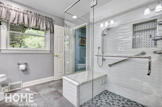 2367 Meadowdown Dr, Owosso, MI 48867 - bathroom with a shower stall and tile patterned floors