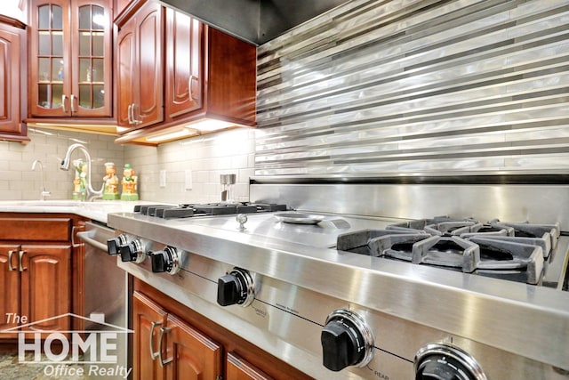 2367 Meadowdown Dr, Owosso, MI 48867 - kitchen featuring tasteful backsplash, glass insert cabinets, and appliances with stainless steel finishes