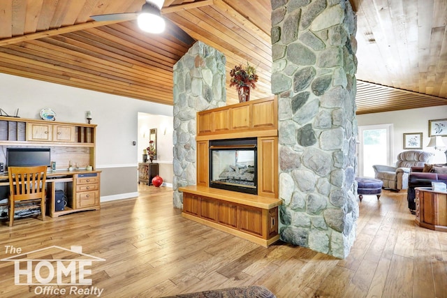 2367 Meadowdown Dr, Owosso, MI 48867 - living room with wooden ceiling, lofted ceiling, light wood finished floors, ceiling fan, and a stone fireplace