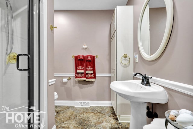 2367 Meadowdown Dr, Owosso, MI 48867 - bathroom featuring toilet and an enclosed shower