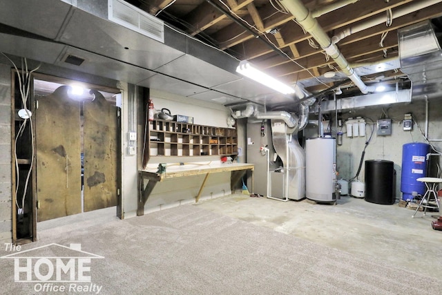 2367 Meadowdown Dr, Owosso, MI 48867 - unfinished below grade area with gas water heater, a water pressure tank, and heating unit