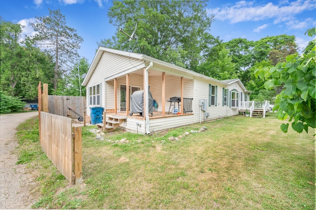 733 N Main St, Evart, MI 49631 - view of front of property featuring a wooden deck