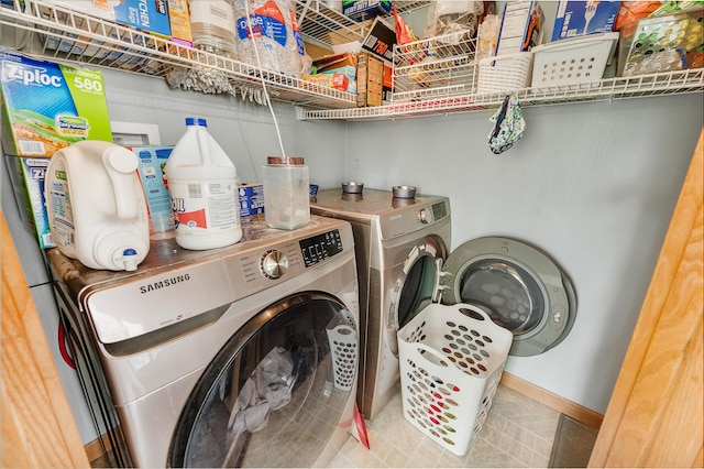 733 N Main St, Evart, MI 49631 - laundry area featuring independent washer and dryer and baseboards