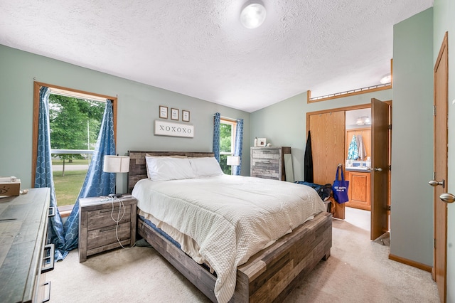 733 N Main St, Evart, MI 49631 - bedroom featuring a textured ceiling and light carpet
