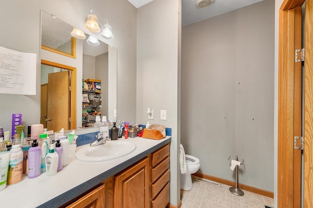 733 N Main St, Evart, MI 49631 - bathroom featuring toilet and vanity