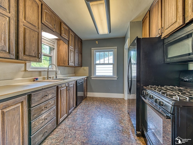 3375 Clinton Way, Jackson, MI 49201 - kitchen with black appliances and light countertops
