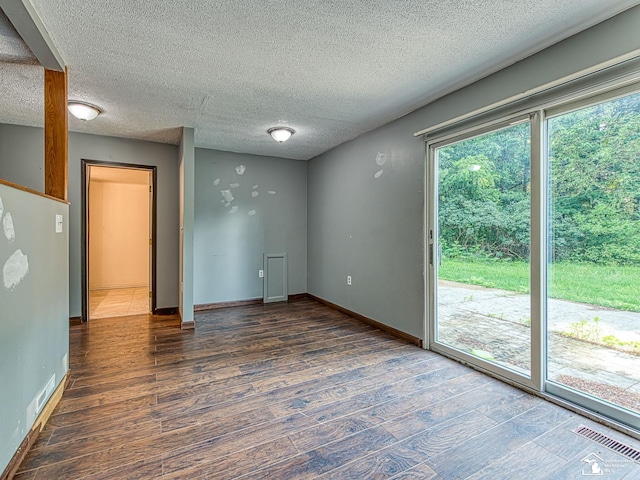 3375 Clinton Way, Jackson, MI 49201 - unfurnished room featuring wood finished floors and a textured ceiling