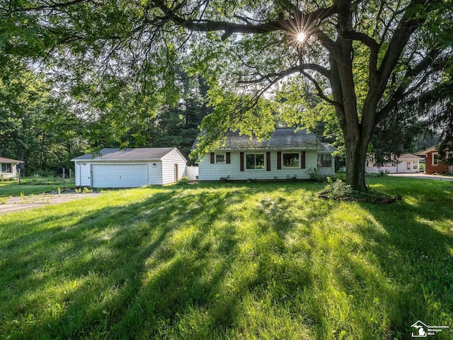 3375 Clinton Way, Jackson, MI 49201 - view of front of property featuring an outbuilding, a garage, and a front lawn