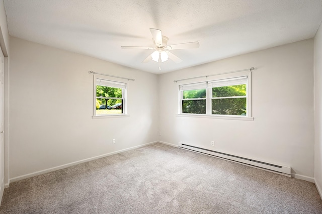 2002 N US Highway 31 Unit 8, Niles, MI 49120 - carpeted empty room featuring a baseboard radiator, healthy amount of natural light, a ceiling fan, and a textured ceiling