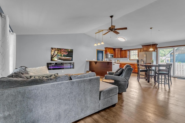 2151 Glenwood Ct, Brooklyn, MI 49230 - living room featuring lofted ceiling, a ceiling fan, and wood finished floors