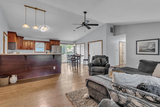 2151 Glenwood Ct, Brooklyn, MI 49230 - living room with ceiling fan, light wood-style flooring, and high vaulted ceiling
