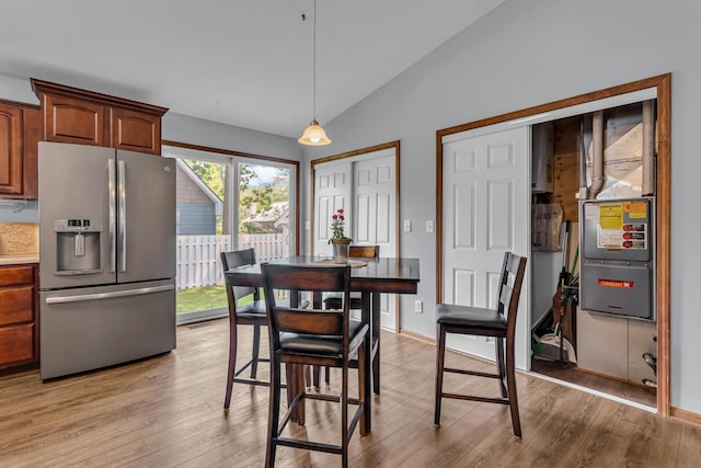 2151 Glenwood Ct, Brooklyn, MI 49230 - dining space with lofted ceiling and light wood-style flooring