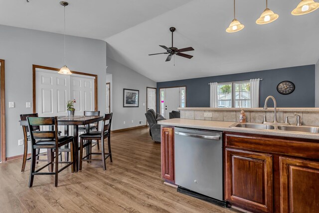 2151 Glenwood Ct, Brooklyn, MI 49230 - kitchen with dishwasher, ceiling fan, lofted ceiling, light wood-style floors, and light countertops