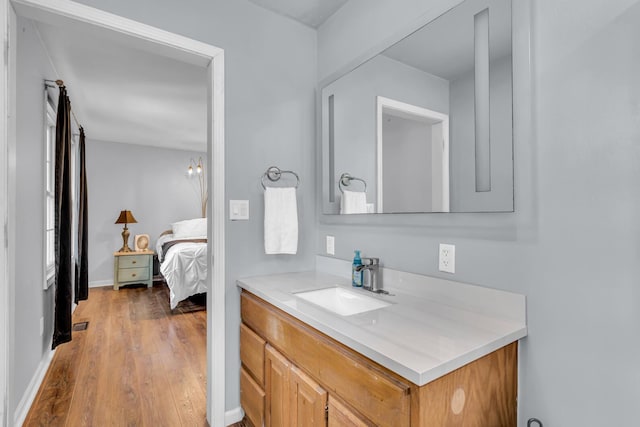 2151 Glenwood Ct, Brooklyn, MI 49230 - ensuite bathroom featuring vanity and wood finished floors