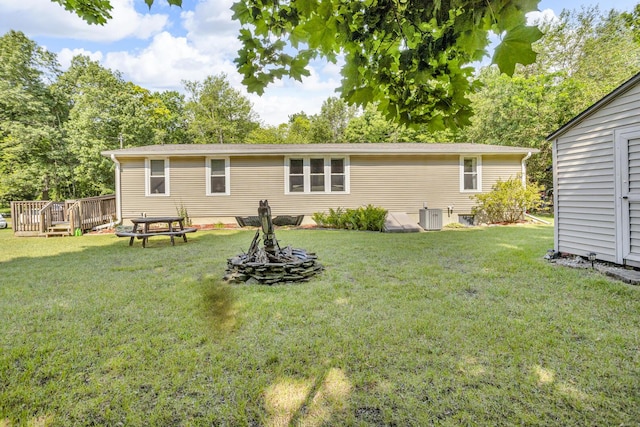 11277 N Dr, Brooklyn, MI 49230 - back of house featuring a wooden deck and a yard