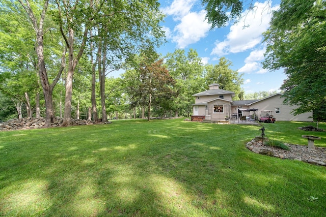 5933 Mccain Rd, Jackson, MI 49201 - view of grassy yard with a deck
