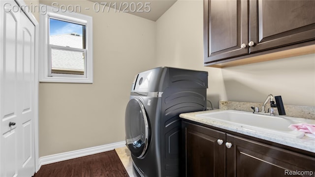 19492 Springbrook Dr, Macomb, MI 48044 - laundry room with cabinet space, washer / dryer, and wood finished floors