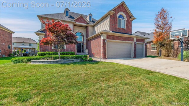19492 Springbrook Dr, Macomb, MI 48044 - view of front facade with driveway, a front lawn, brick siding, and a garage