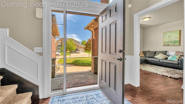 19492 Springbrook Dr, Macomb, MI 48044 - entryway featuring a wainscoted wall, wood finished floors, and a decorative wall
