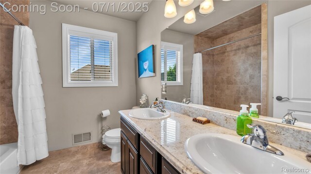 19492 Springbrook Dr, Macomb, MI 48044 - bathroom featuring double vanity, shower / bath combination with curtain, and tile patterned flooring