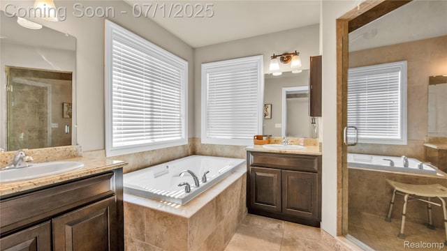 19492 Springbrook Dr, Macomb, MI 48044 - bathroom featuring two vanities, a shower stall, tile patterned floors, and a bath