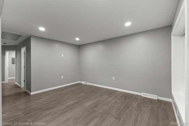 1587 Reo Ave, Lincoln Park, MI 48146 - empty room with attic access, dark wood-style floors, and recessed lighting