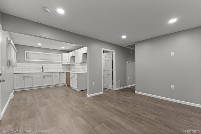 1587 Reo Ave, Lincoln Park, MI 48146 - unfurnished living room with wood finished floors and recessed lighting