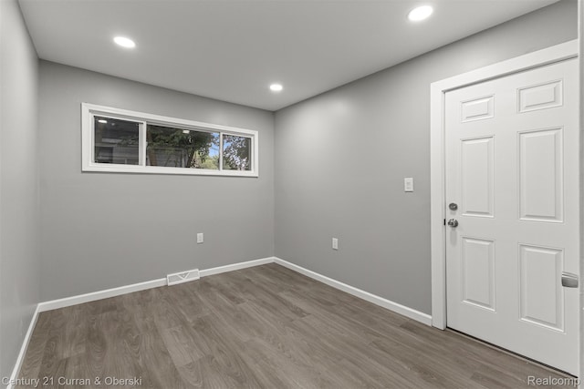 1587 Reo Ave, Lincoln Park, MI 48146 - unfurnished room with wood finished floors and recessed lighting
