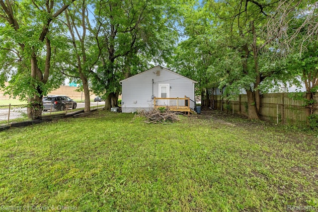 1587 Reo Ave, Lincoln Park, MI 48146 - fenced backyard with a wooden deck