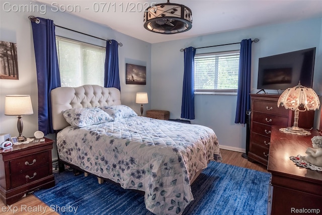 9595 Pearl Beach Blvd, Clay, MI 48001 - bedroom featuring wood finished floors and baseboards