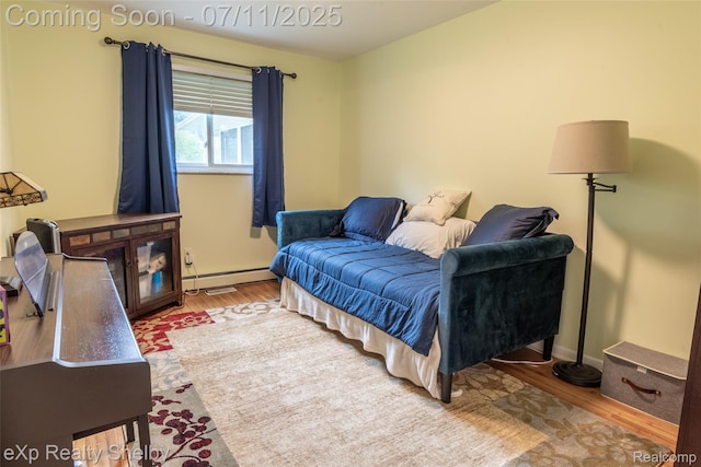 9595 Pearl Beach Blvd, Clay, MI 48001 - bedroom featuring a baseboard radiator and wood finished floors