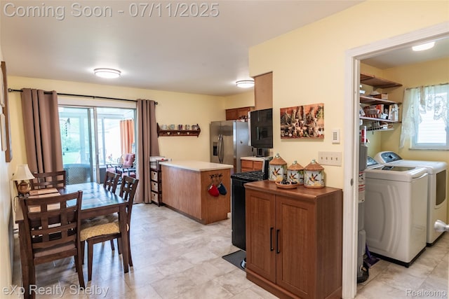 9595 Pearl Beach Blvd, Clay, MI 48001 - kitchen with independent washer and dryer, stainless steel refrigerator with ice dispenser, brown cabinetry, and light countertops