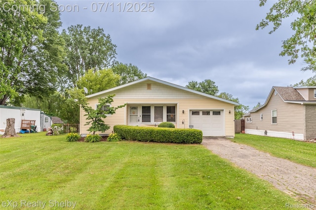 9595 Pearl Beach Blvd, Clay, MI 48001 - view of front facade with a front yard, asphalt driveway, and a garage