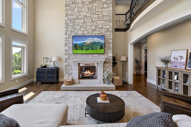 1988 Christenbury Ct, Rochester, MI 48306 - living room with plenty of natural light, a stone fireplace, a high ceiling, and wood finished floors