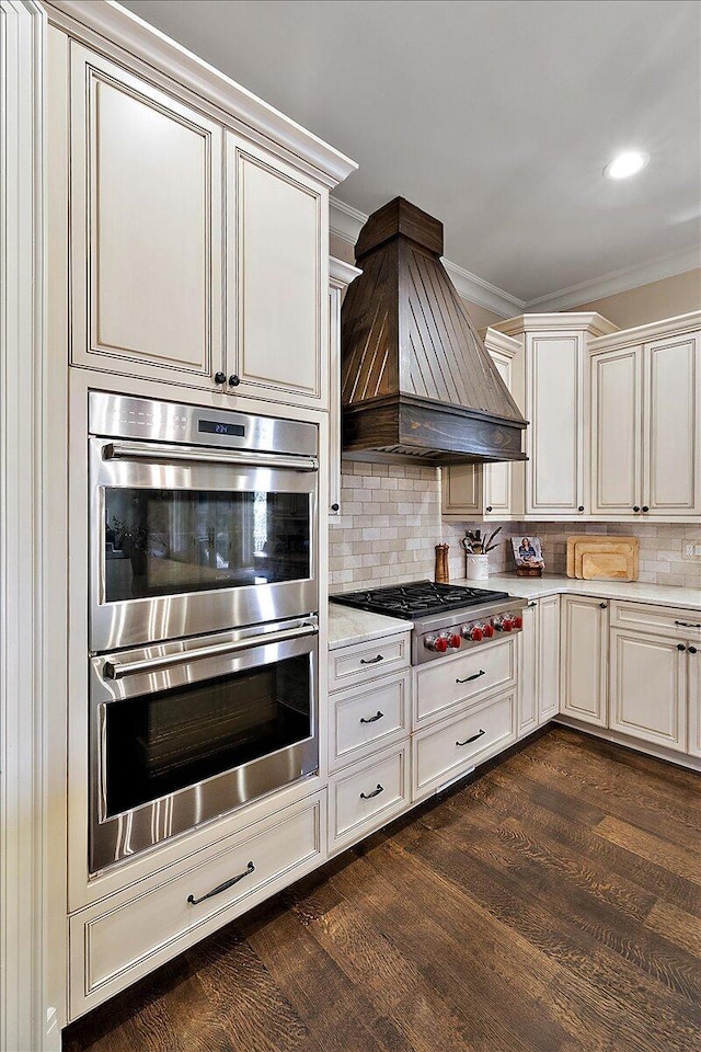 1988 Christenbury Ct, Rochester, MI 48306 - kitchen featuring appliances with stainless steel finishes, premium range hood, crown molding, backsplash, and dark wood finished floors