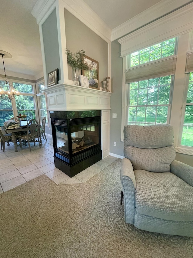 3643 Waterway Ct, Grass Lake, MI 49240 - living room with a chandelier, light tile patterned floors, a multi sided fireplace, and crown molding