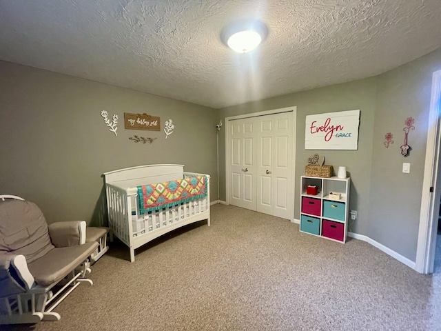 3643 Waterway Ct, Grass Lake, MI 49240 - bedroom with carpet floors, a closet, a textured ceiling, and a nursery area
