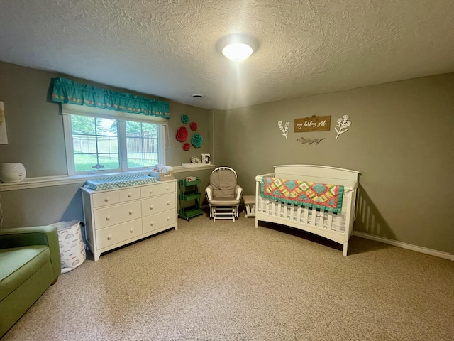 3643 Waterway Ct, Grass Lake, MI 49240 - bedroom featuring a textured ceiling, a crib, and light colored carpet