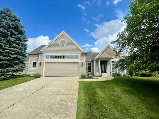 3643 Waterway Ct, Grass Lake, MI 49240 - view of front of home featuring a front yard, a garage, driveway, and brick siding